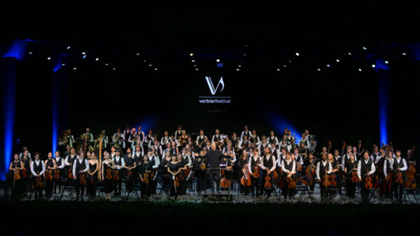 Gianandrea Noseda stands on the podium with the Verbier Festival Orchestra assembled behind him at Salle des Combins.